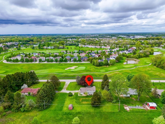 bird's eye view featuring view of golf course, a water view, and a residential view