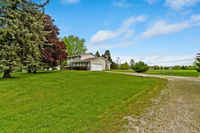 exterior space featuring driveway and a garage