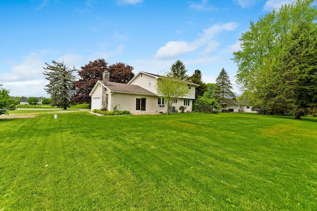 view of yard with an attached garage