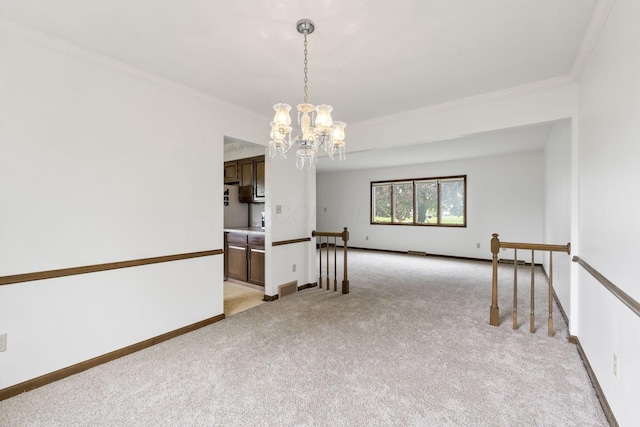 empty room with light colored carpet, baseboards, ornamental molding, and a notable chandelier