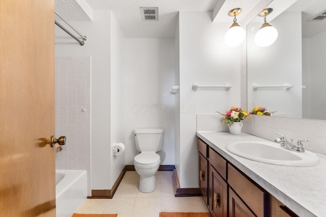 bathroom with toilet, tile patterned flooring, vanity, and visible vents