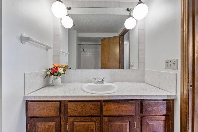 bathroom featuring decorative backsplash and vanity