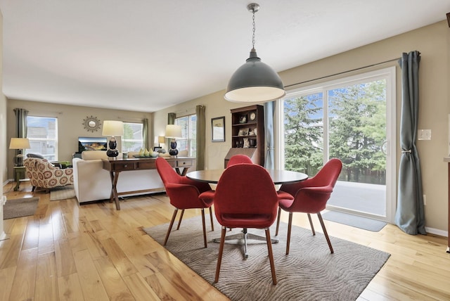 dining area with light wood-type flooring