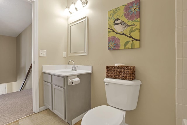 bathroom featuring toilet and vanity