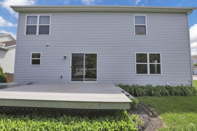 back of property with a deck