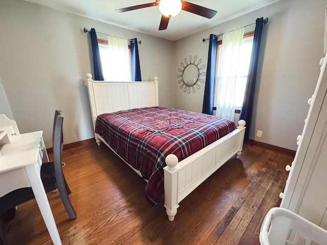 bedroom featuring baseboards, a ceiling fan, and hardwood / wood-style floors
