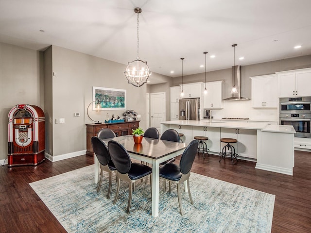 dining space featuring an inviting chandelier, baseboards, recessed lighting, and dark wood finished floors