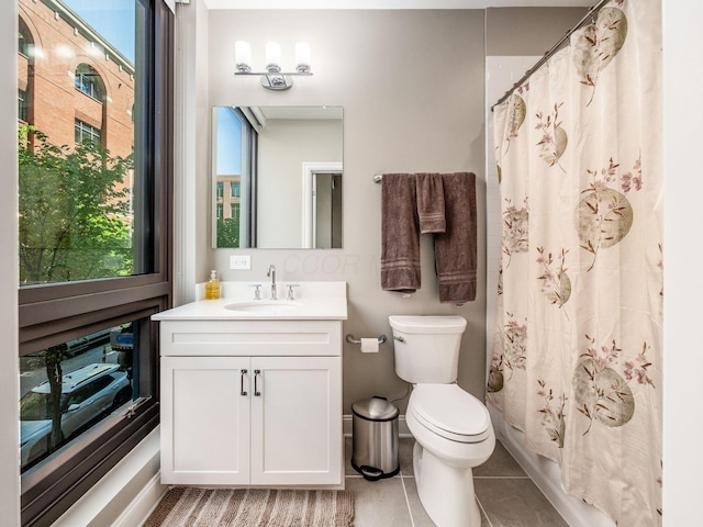 full bathroom featuring vanity, tile patterned flooring, toilet, and a shower with shower curtain