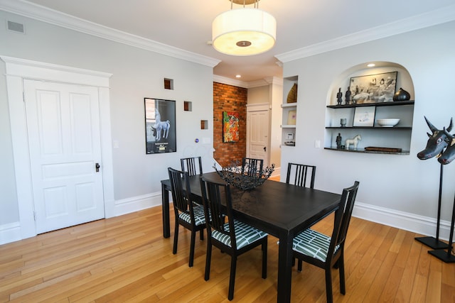 200 Thurman Ave, Columbus, OH 43206 - dining space with visible vents, ornamental molding, light wood-style floors, and baseboards