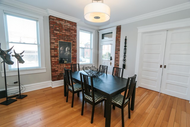 200 Thurman Ave, Columbus, OH 43206 - dining room with baseboards, ornamental molding, and light wood finished floors