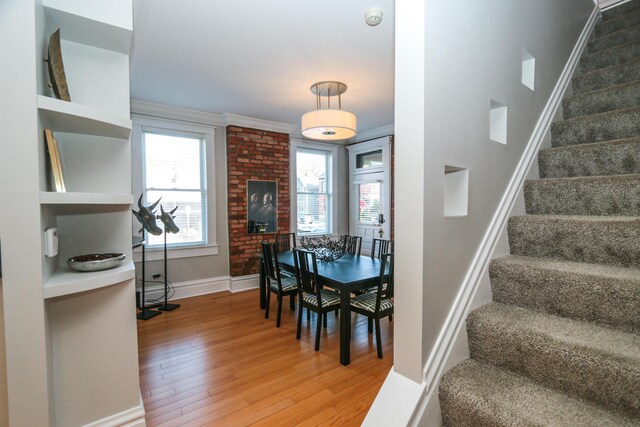 200 Thurman Ave, Columbus, OH 43206 - staircase with crown molding, baseboards, and hardwood / wood-style flooring