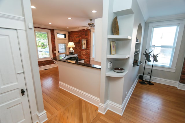 200 Thurman Ave, Columbus, OH 43206 - interior space with crown molding, dark countertops, ceiling fan, baseboards, and light wood-type flooring