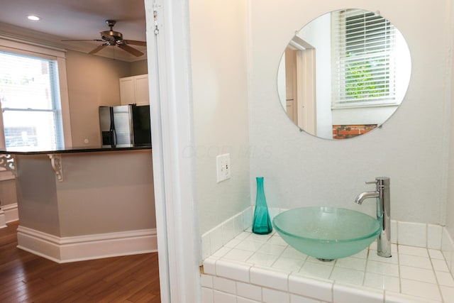 200 Thurman Ave, Columbus, OH 43206 - bathroom featuring ceiling fan, a sink, baseboards, and wood finished floors