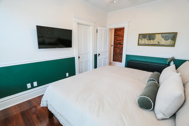 200 Thurman Ave, Columbus, OH 43206 - bedroom with crown molding, baseboards, a closet, and wood finished floors