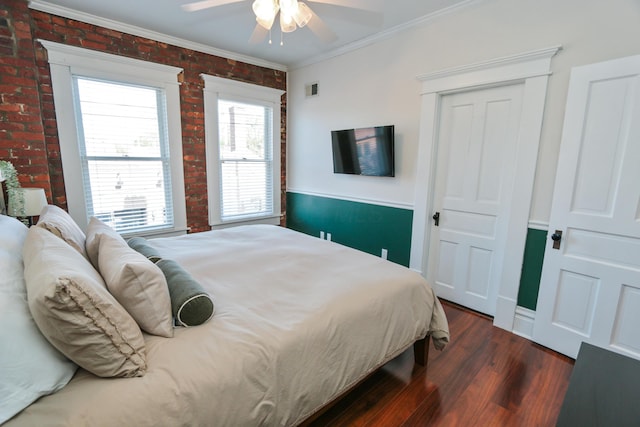 200 Thurman Ave, Columbus, OH 43206 - bedroom with dark wood-style flooring, brick wall, visible vents, ornamental molding, and a closet