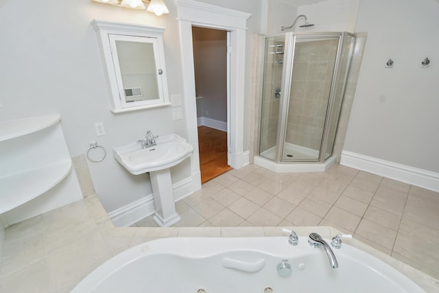 200 Thurman Ave, Columbus, OH 43206 - full bath with baseboards, tile patterned flooring, a shower stall, and a tub with jets