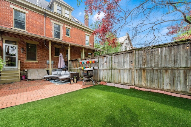 200 Thurman Ave, Columbus, OH 43206 - view of yard with an outdoor living space, a fenced backyard, a patio area, and entry steps