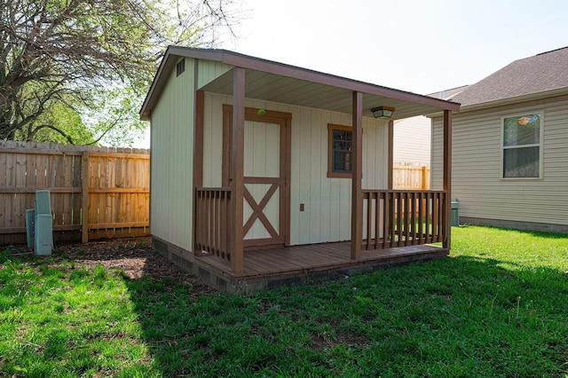 view of shed featuring fence