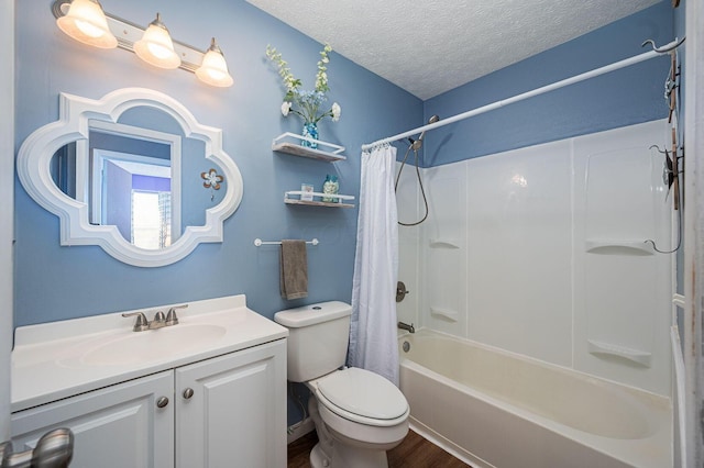 bathroom featuring a textured ceiling, wood finished floors, vanity, toilet, and shower / bathtub combination with curtain