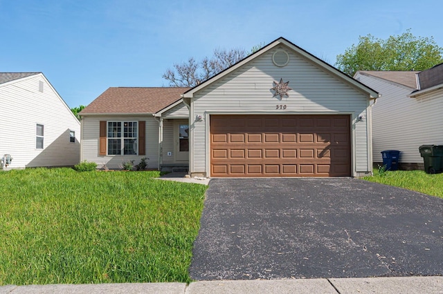 ranch-style house with driveway, a front yard, and a garage