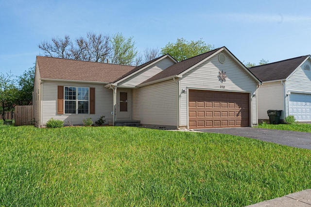 single story home featuring fence, driveway, a front lawn, and a garage