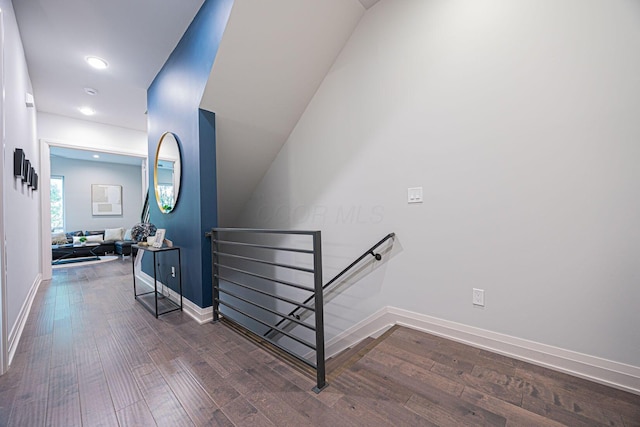 stairway featuring baseboards, recessed lighting, and wood finished floors