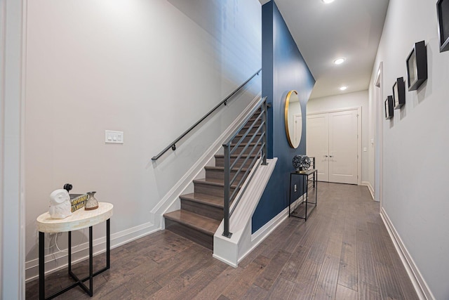 interior space with baseboards, recessed lighting, and wood finished floors