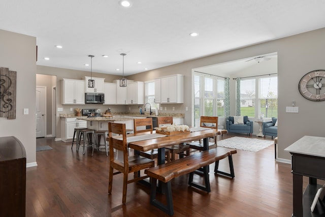 dining area with dark wood-type flooring, recessed lighting, and baseboards