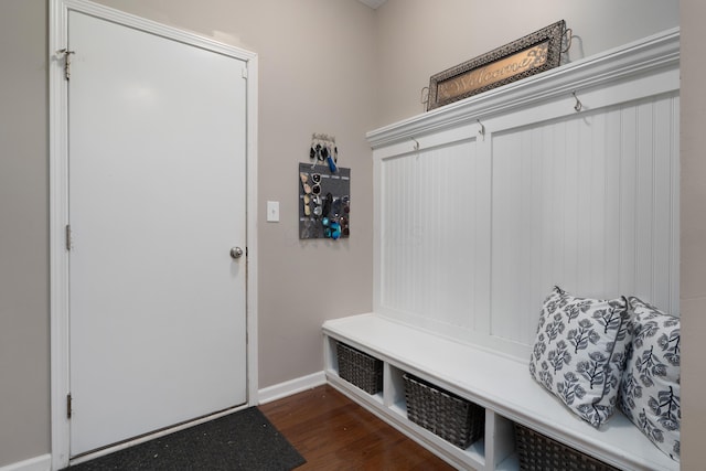 mudroom with baseboards and dark wood finished floors