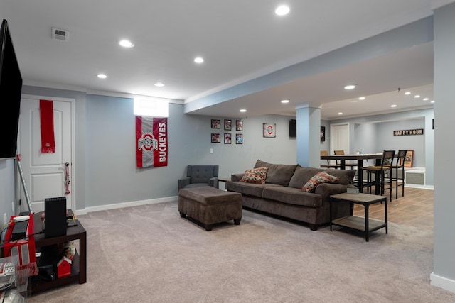 living room featuring recessed lighting, baseboards, visible vents, and light carpet