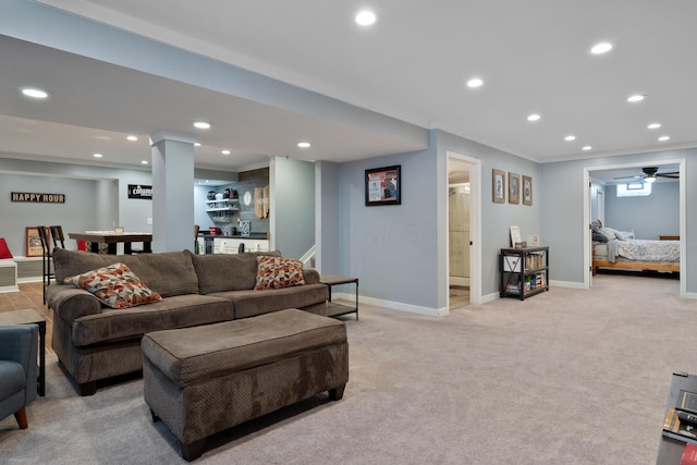 living area with baseboards, recessed lighting, light carpet, and a dry bar