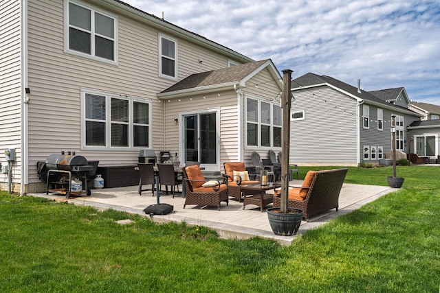 back of house featuring a patio, outdoor lounge area, and a lawn