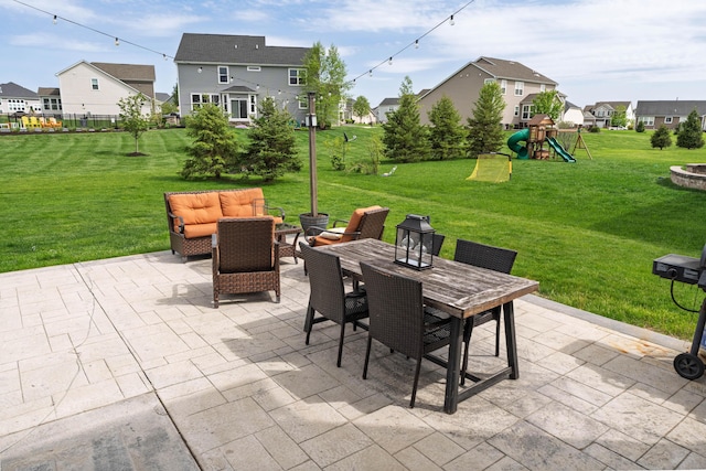 view of patio / terrace featuring an outdoor living space, outdoor dining area, a playground, and a residential view