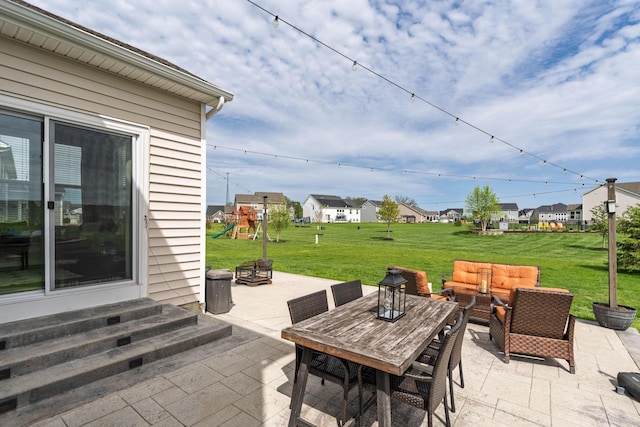 view of patio / terrace featuring a playground, outdoor lounge area, a residential view, and entry steps