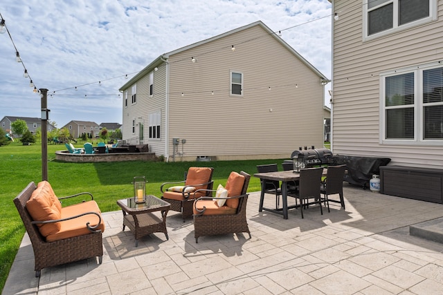 view of patio featuring outdoor dining area, an outdoor living space, and grilling area