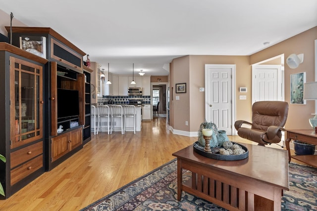 47 Richards Rd, Columbus, OH 43214 - living area featuring light wood-style floors and baseboards