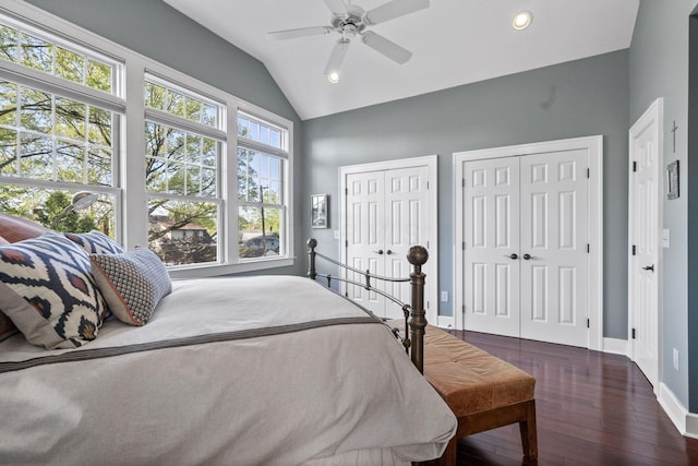 47 Richards Rd, Columbus, OH 43214 - bedroom with dark wood-style flooring, lofted ceiling, two closets, baseboards, and recessed lighting