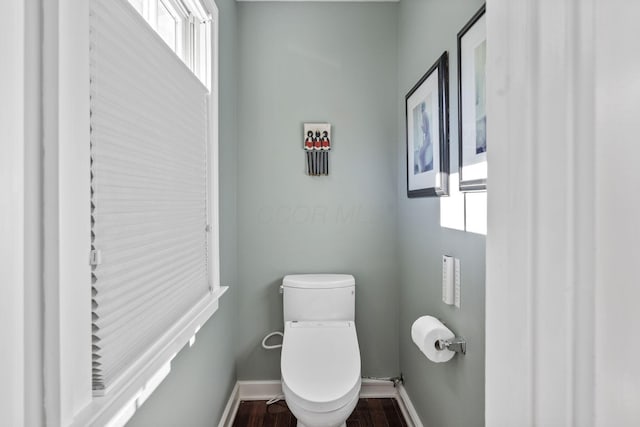 47 Richards Rd, Columbus, OH 43214 - bathroom featuring baseboards, wood finished floors, and toilet