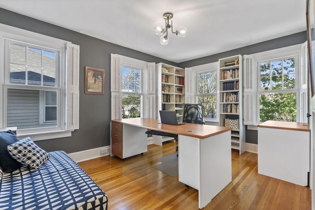 47 Richards Rd, Columbus, OH 43214 - office featuring an inviting chandelier, baseboards, and light wood-type flooring