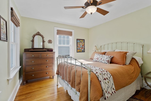47 Richards Rd, Columbus, OH 43214 - bedroom featuring baseboards, a ceiling fan, and light wood-style flooring
