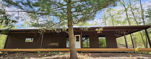 view of side of home featuring metal roof