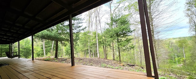 deck featuring a view of trees