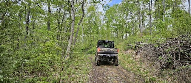 exterior space with a wooded view