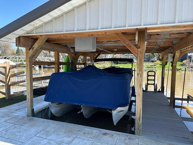 exterior space featuring a water view and boat lift