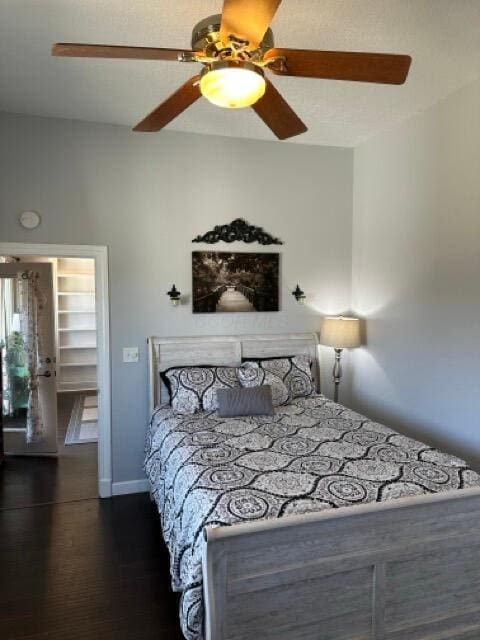 bedroom with ceiling fan and wood finished floors