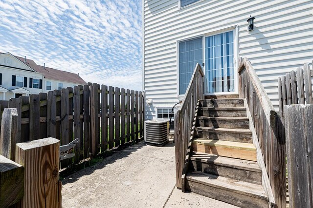 6388 Loblolly Dr, Canal Winchester, OH 43110 - view of exterior entry featuring fence and cooling unit