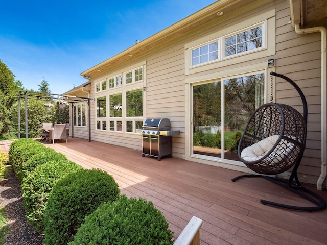 back of property with outdoor dining area and a deck