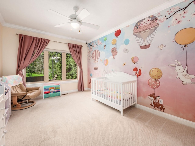 bedroom featuring carpet flooring, a nursery area, crown molding, and baseboards