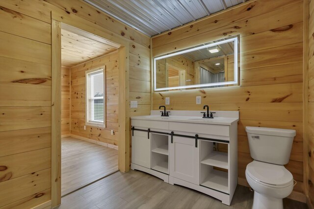 7435 Baltimore Somerset Rd NE, Thornville, OH 43076 - bathroom with toilet, wood walls, and wood finished floors