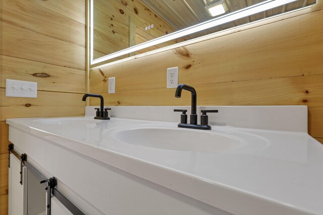 7435 Baltimore Somerset Rd NE, Thornville, OH 43076 - bathroom featuring double vanity, a sink, and wooden walls